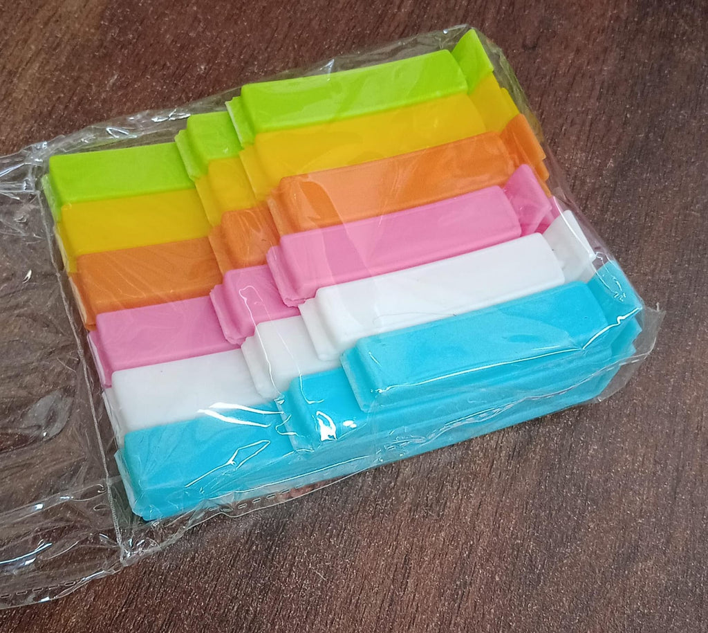 A person demonstrating how to use the food bag clips for sealing.