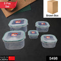 A 5-piece set of clear plastic kitchen storage containers with blue lids.