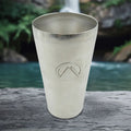 Front view of a sleek stainless steel travel mug, perfect for on-the-go hydration.