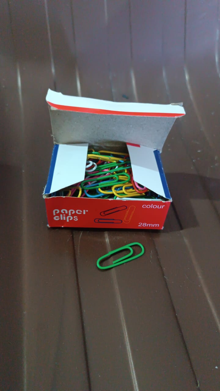 Documents of various colors held firmly with metal U-shape 28mm paper clips