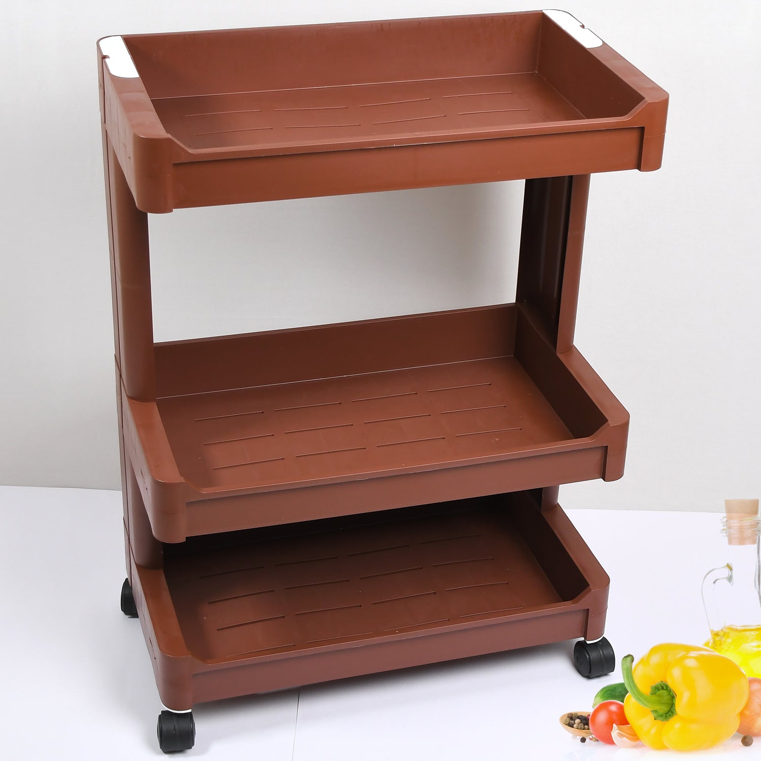Plastic serving trolley with smooth-rolling wheels for convenient home use.
