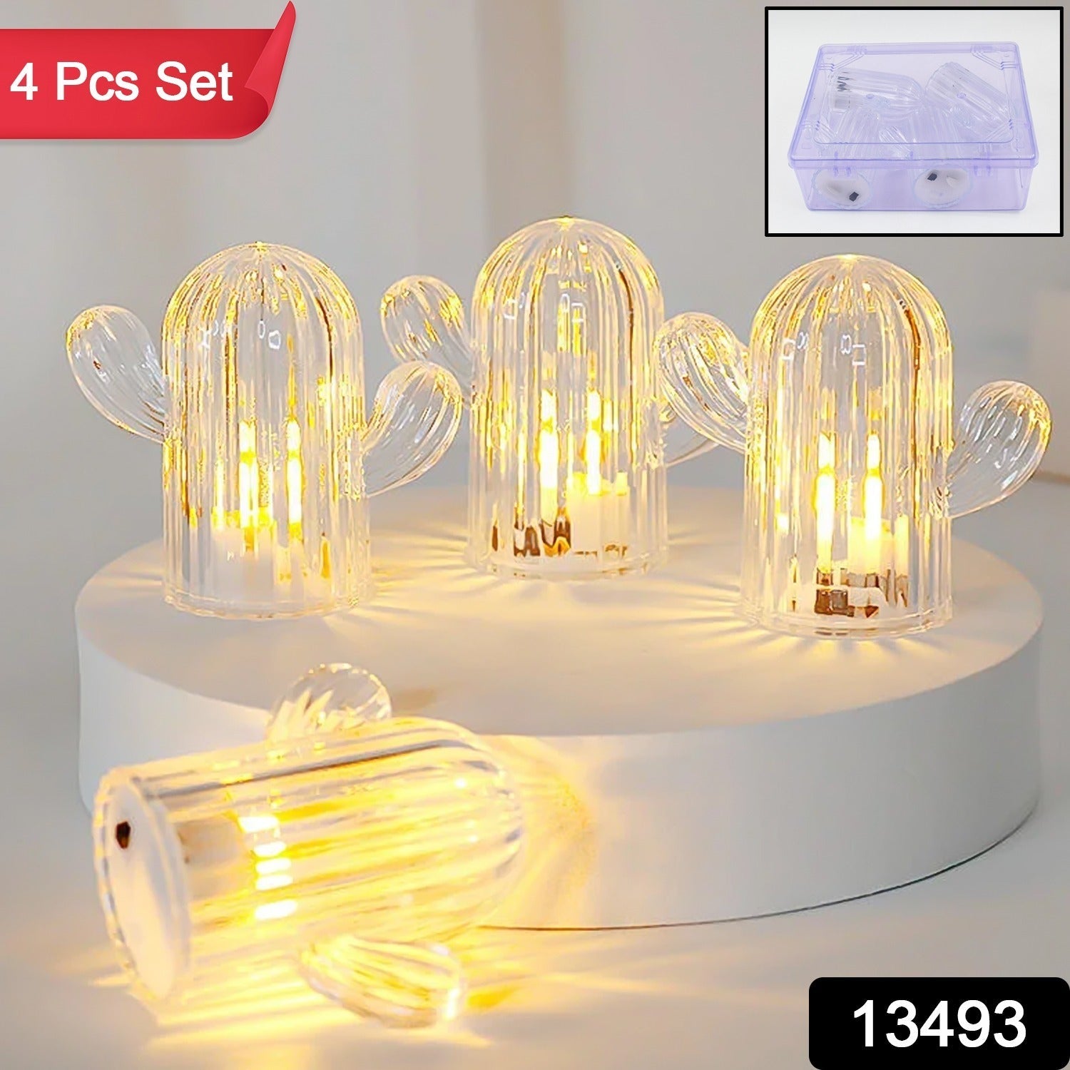 Close-up of a single warm plastic night light shaped like a cactus, emitting a soft light.