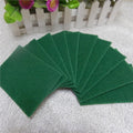Green kitchen scrubber pads in a 10-pack, ready for multipurpose cleaning tasks.