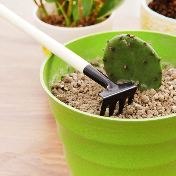 Close-up of the small rake from the Kids Garden Tools Set, perfect for little hands.