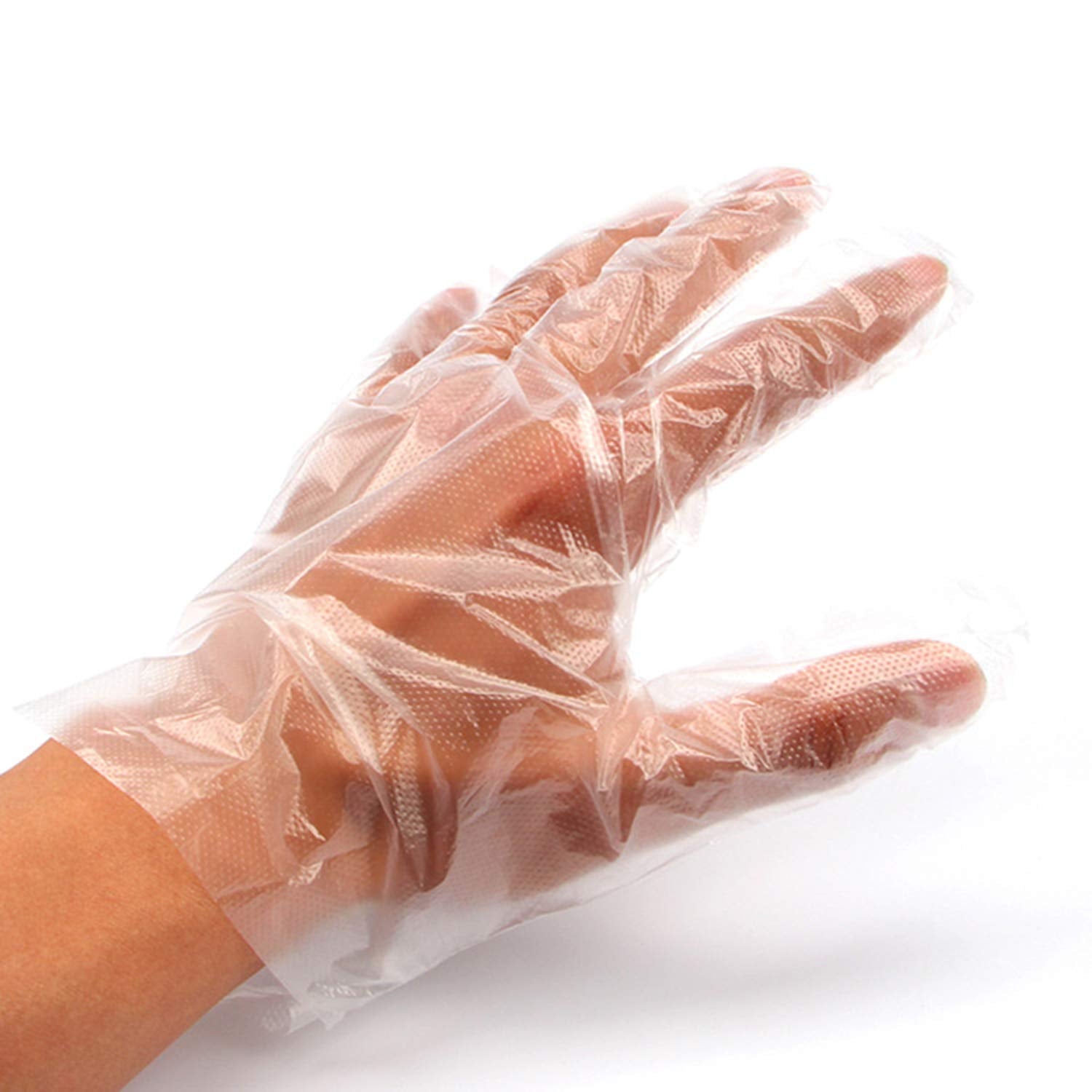Person wearing disposable clear gloves while performing a task, ensuring hygiene.
