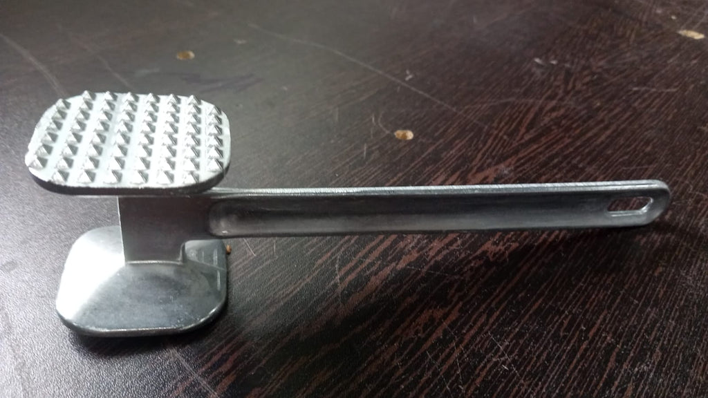 Heavy-duty meat tenderizer hammer, ideal for tenderizing beef steaks.