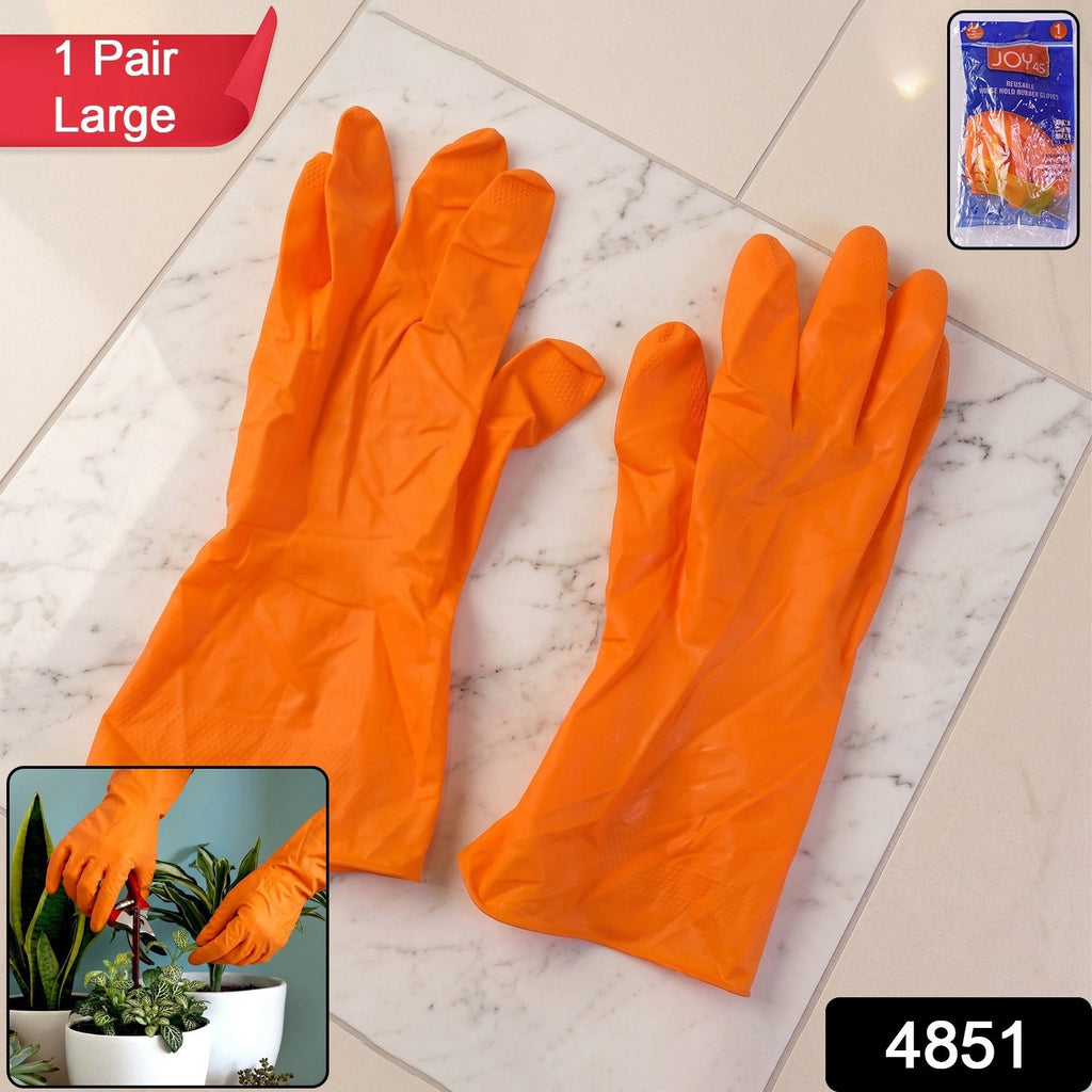 Pair of bright orange dishwashing gloves for household chores