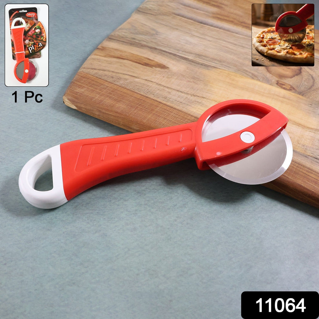 Close-up of pizza slicer wheel cutting smooth pizza slices