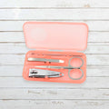 AuriGlam portable nail clipper set in its clear plastic travel case.