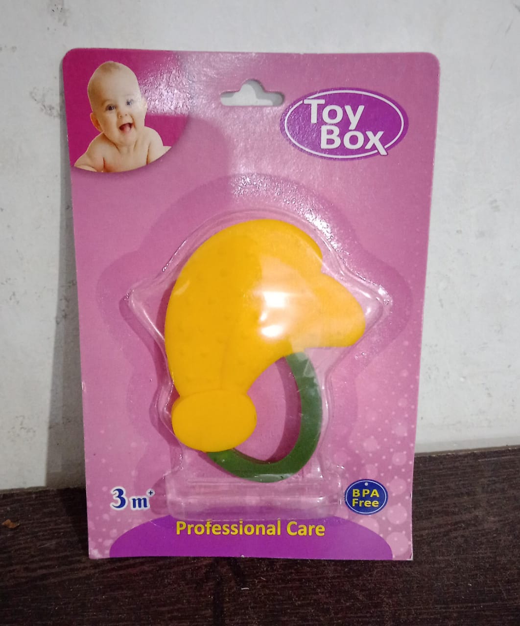 The Baby Silicone Teether placed in a freezer, indicating its freezer-safe feature for cooling relief.