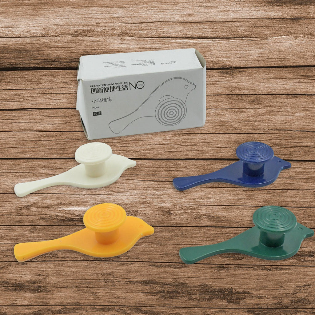 Four charming bird-shaped adhesive hooks neatly arranged, ready for use.