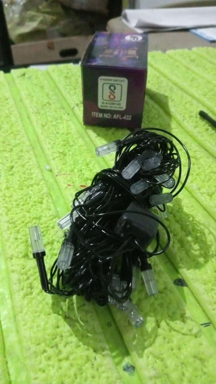 The LED string light product packaging displaying key features.