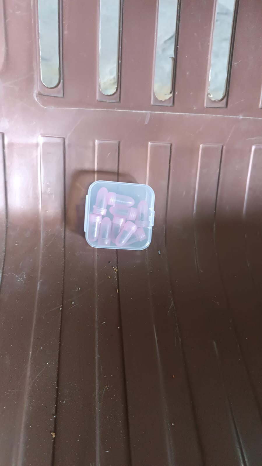 Rubber tire repair nails displayed in their compact storage box.