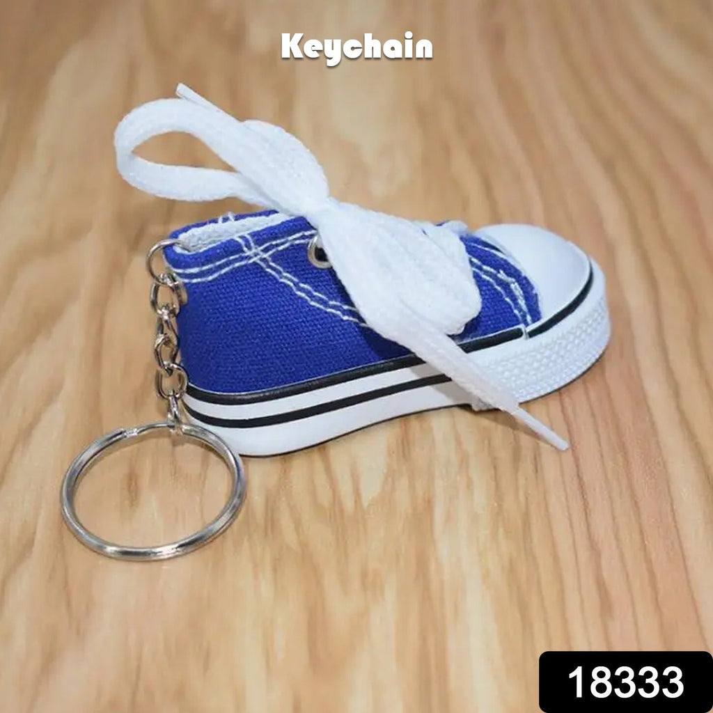 Realistic white sneaker Mini Shoe Keychain with detailed laces.