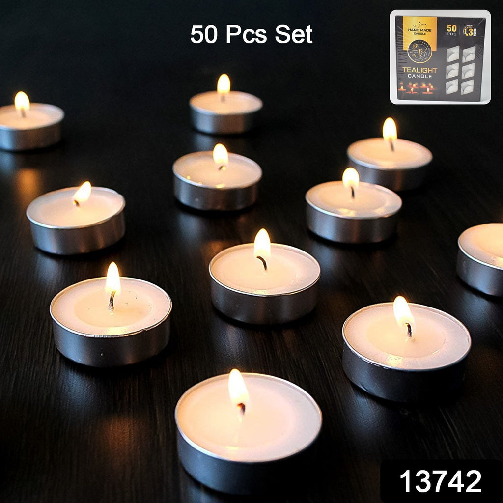 Close-up of multiple unscented tealight candles glowing warmly.