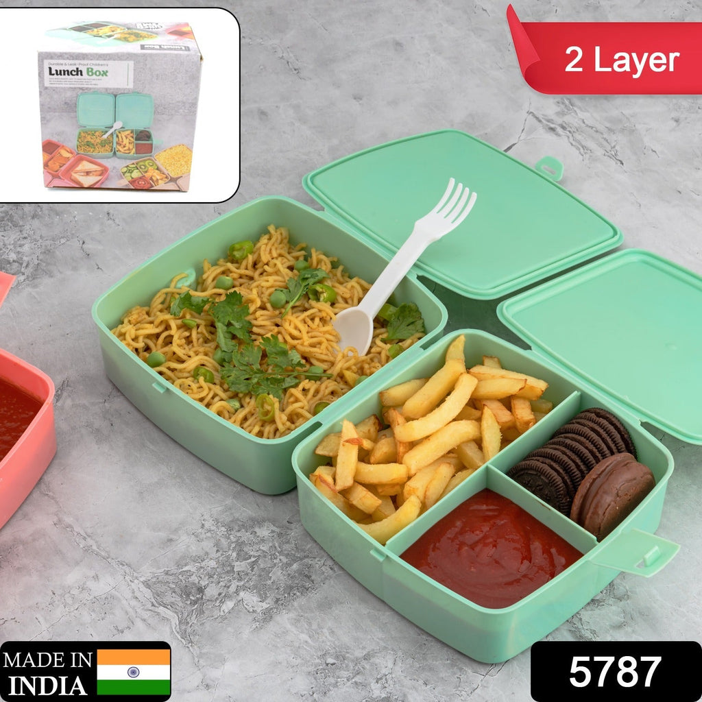 Open blue 4-compartment tiffin box, showcasing the internal sections and included spoon.