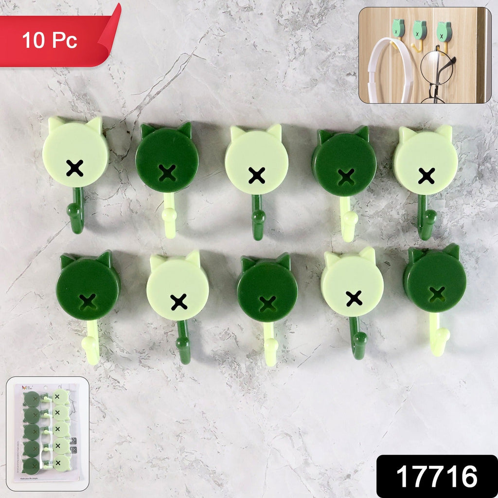 Self adhesive wall hooks holding keys and cables securely on a tile surface