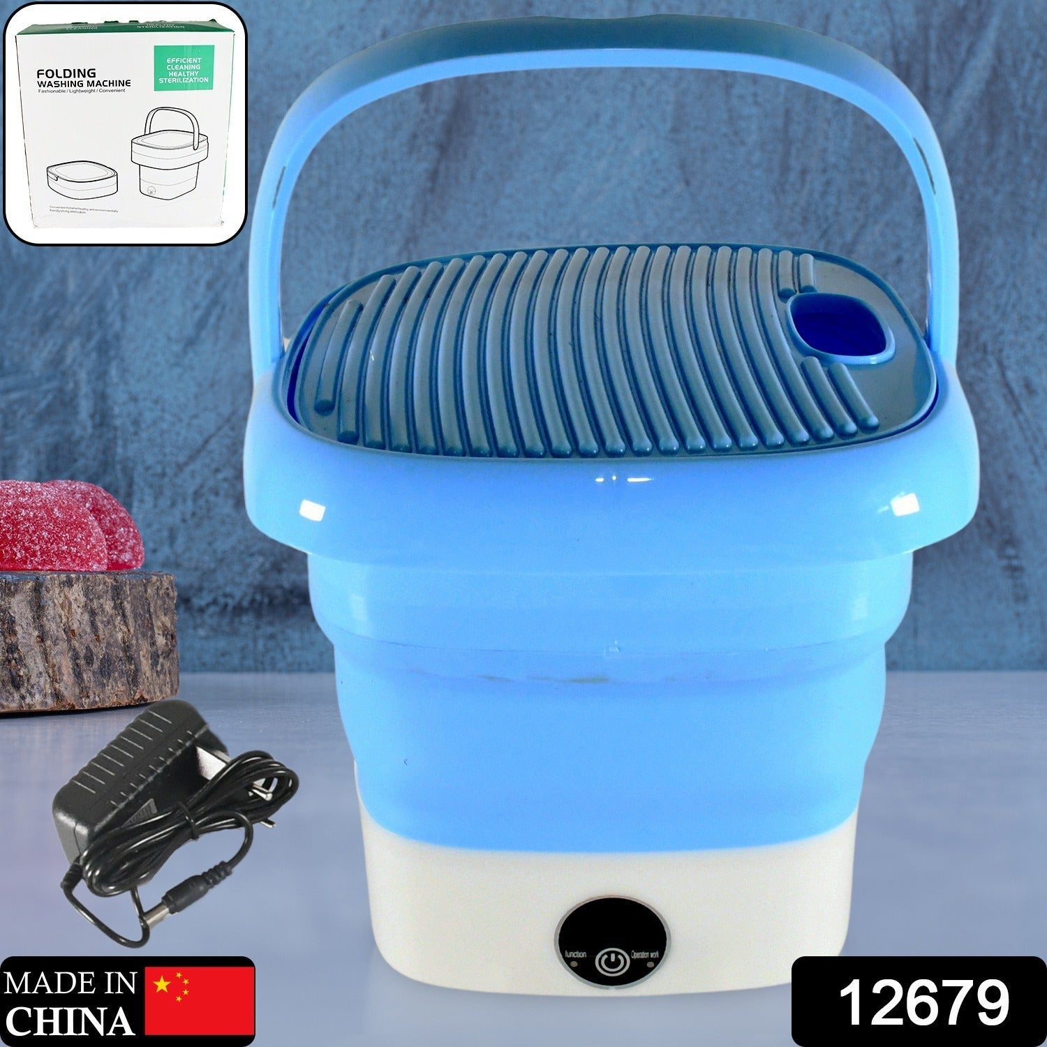Compact mini washer with clothes inside, perfect for washing small garments.