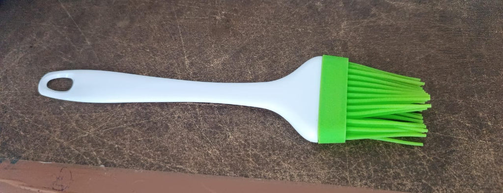 Silicone brush used for grilling and barbecues, part of CookAura kitchen utensils