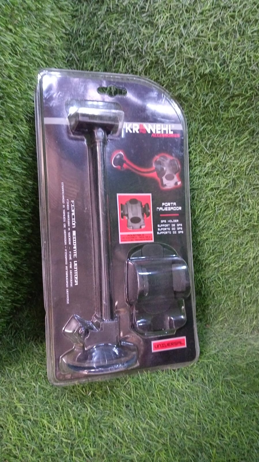 Universal car mobile holder with flexible arm and suction base in a car interior.