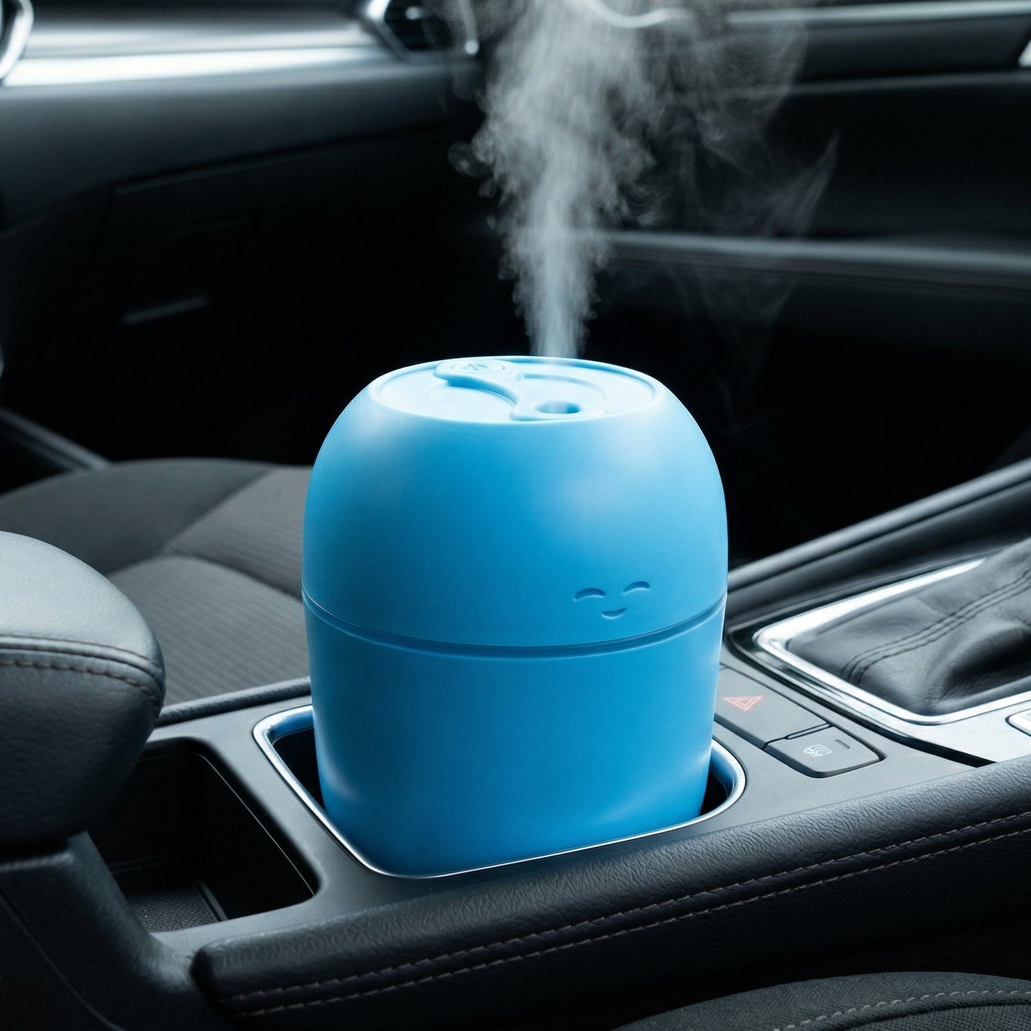 A person’s hand adjusting the settings on the small, portable USB Air Humidifier.