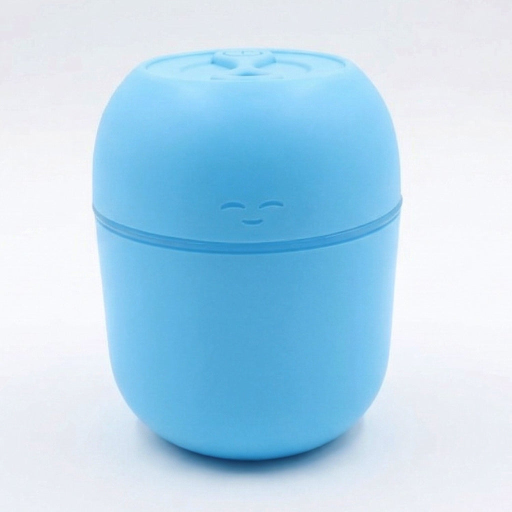 Top-down view of the USB Air Humidifier, showing the water tank and control button.
