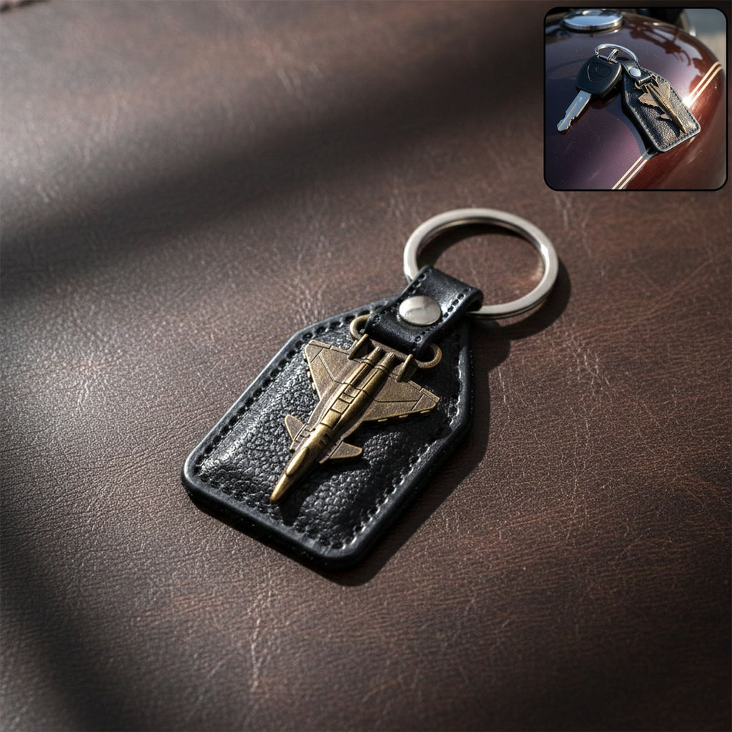 Aircraft design metal keychain with fighter jet emblem on leather-finish base