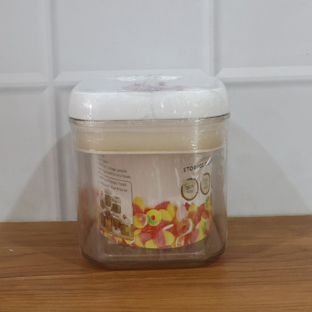 Transparent airtight jar with vibrant red lid for snacks