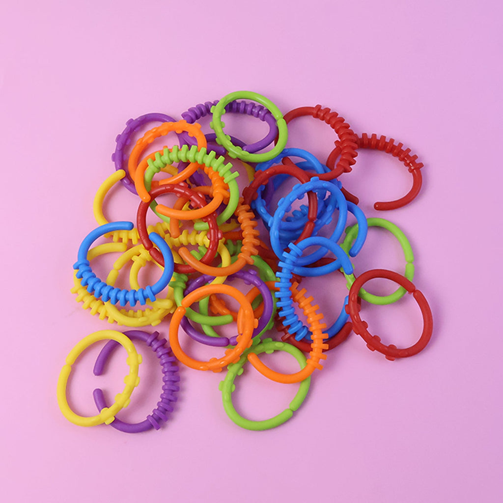 Toddler learning link rings to develop hand-eye coordination