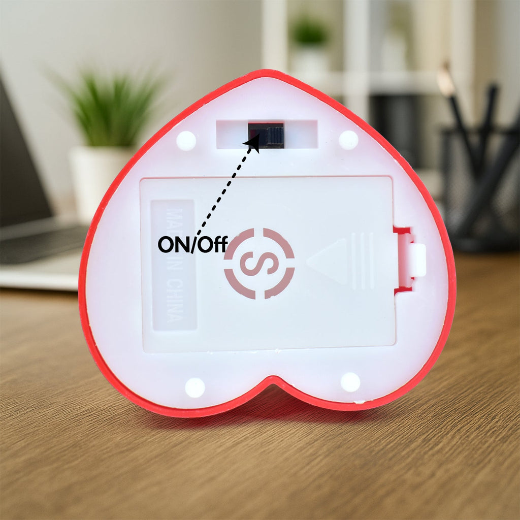Decorative resin figurine of romantic couple with heart frame for gifting