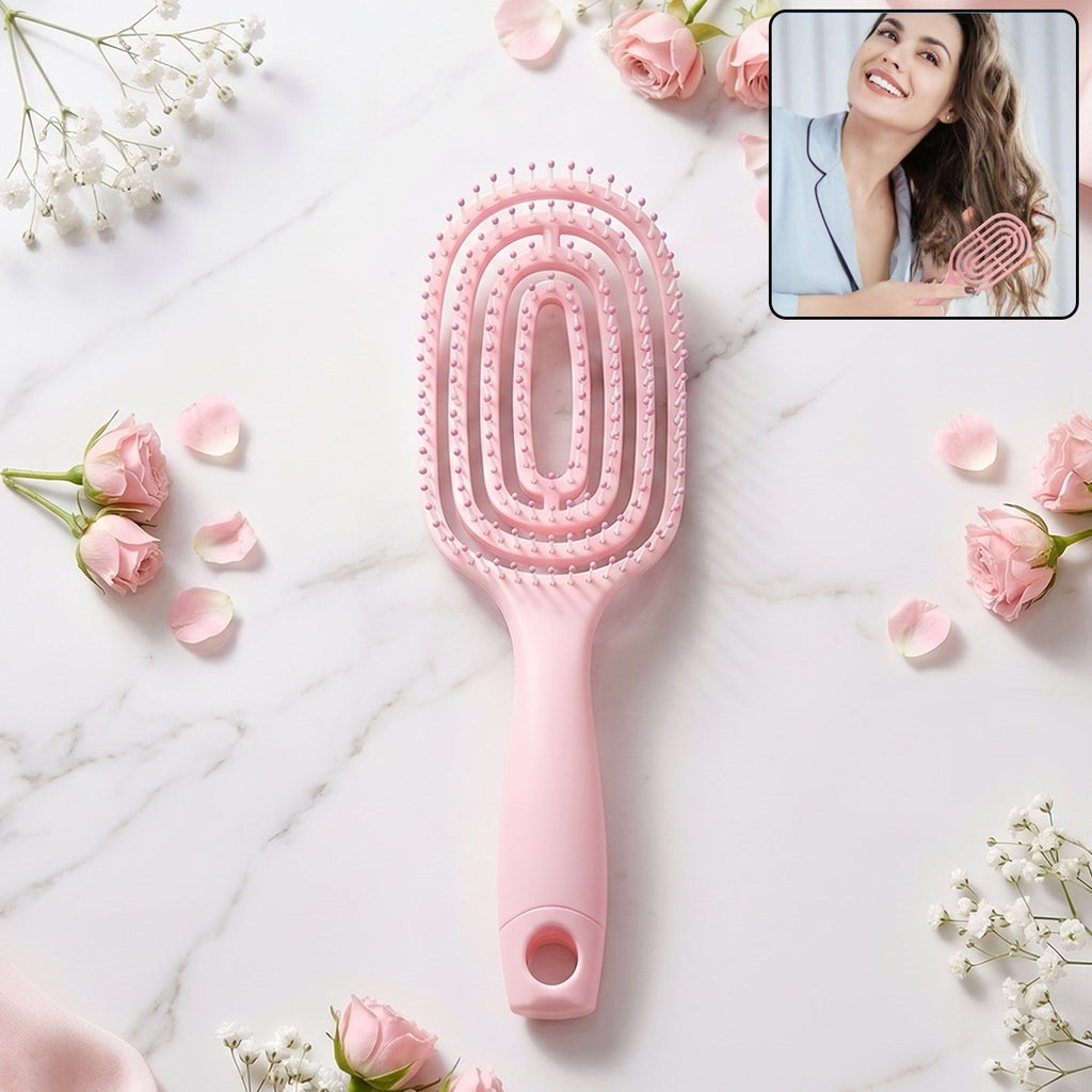 Pink curved vented detangling hair brush designed for effortless hairstyling