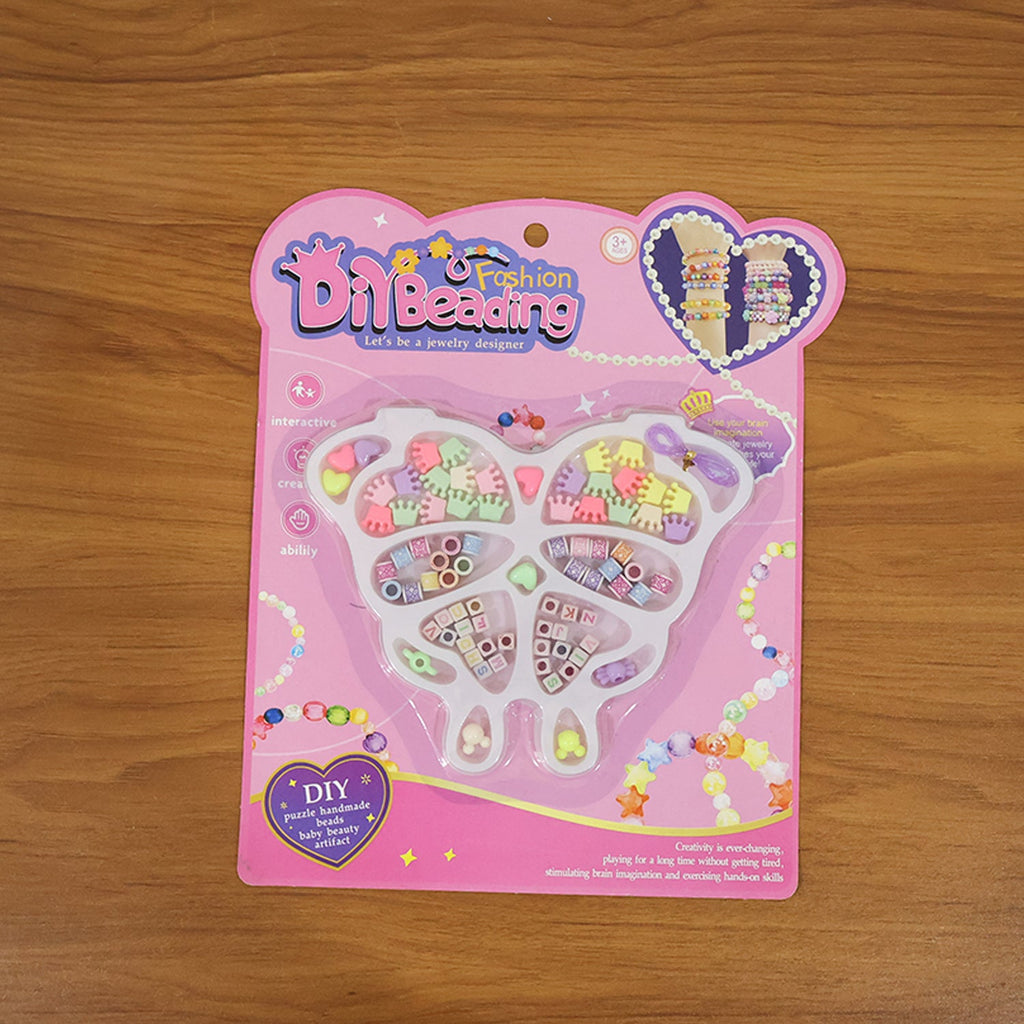 Creative kids using jewellery making kit to craft bracelets and necklaces