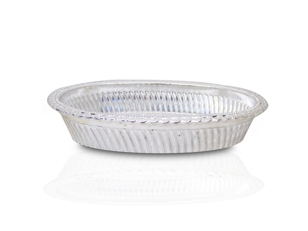Elegant oval silver tray showcasing its royal embossed design.