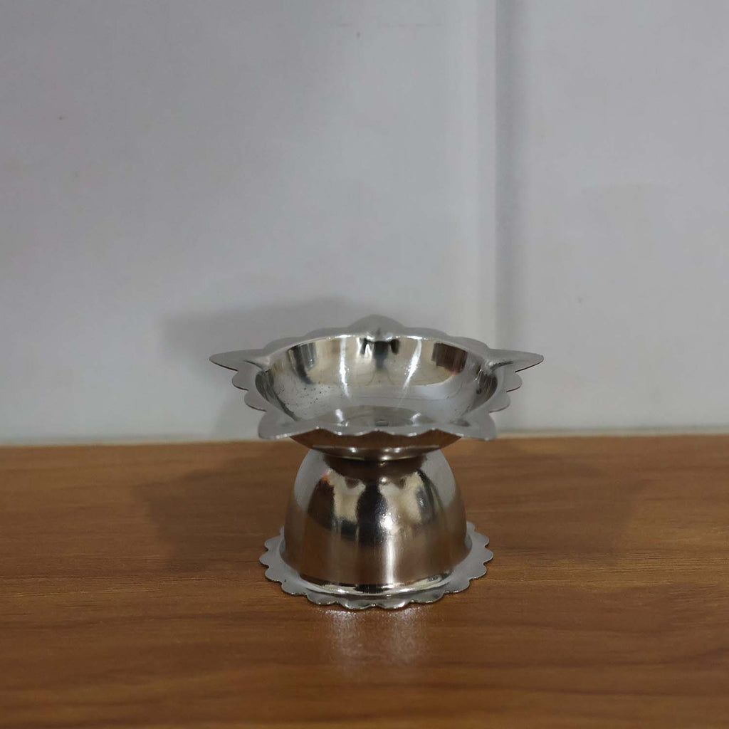 Silver-toned stainless steel sunflower diya for pooja and aarti rituals
