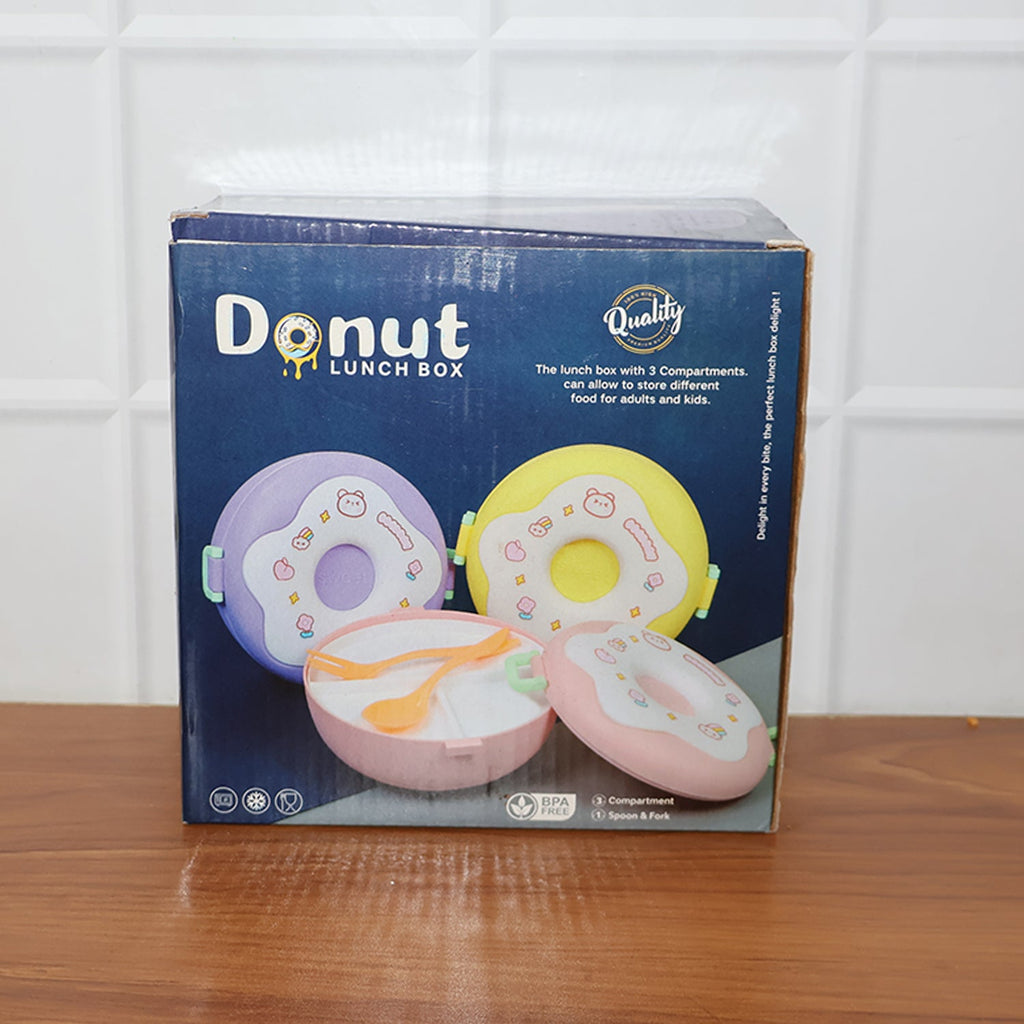 Person holding a Donut Lunch Box, demonstrating its portable design.