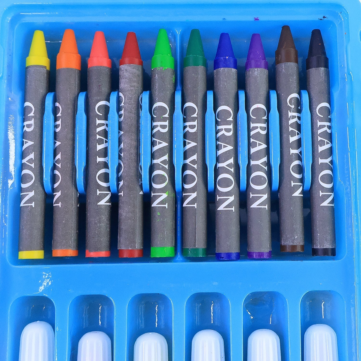 Close-up of vibrant sketch pens and oil pastels in kids art set