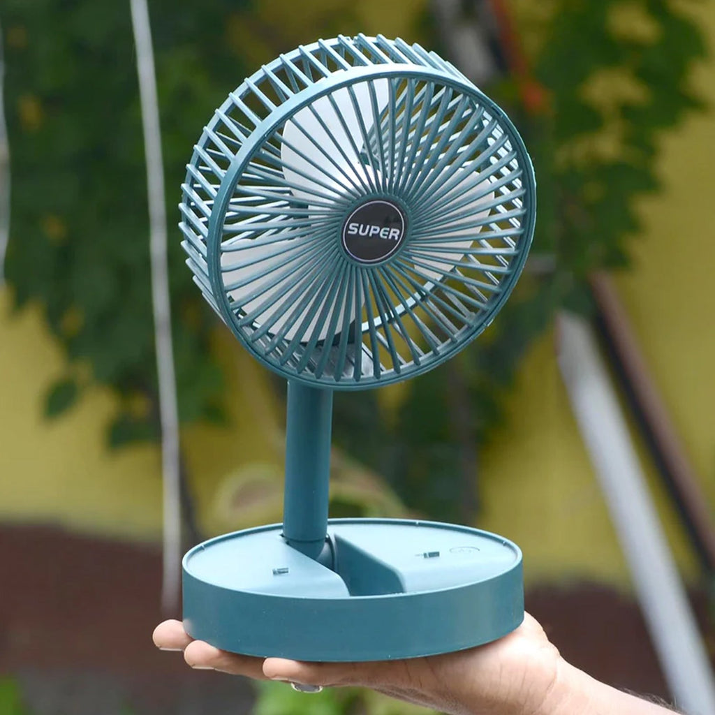 Side angle of foldable mini desk fan highlighting adjustable height