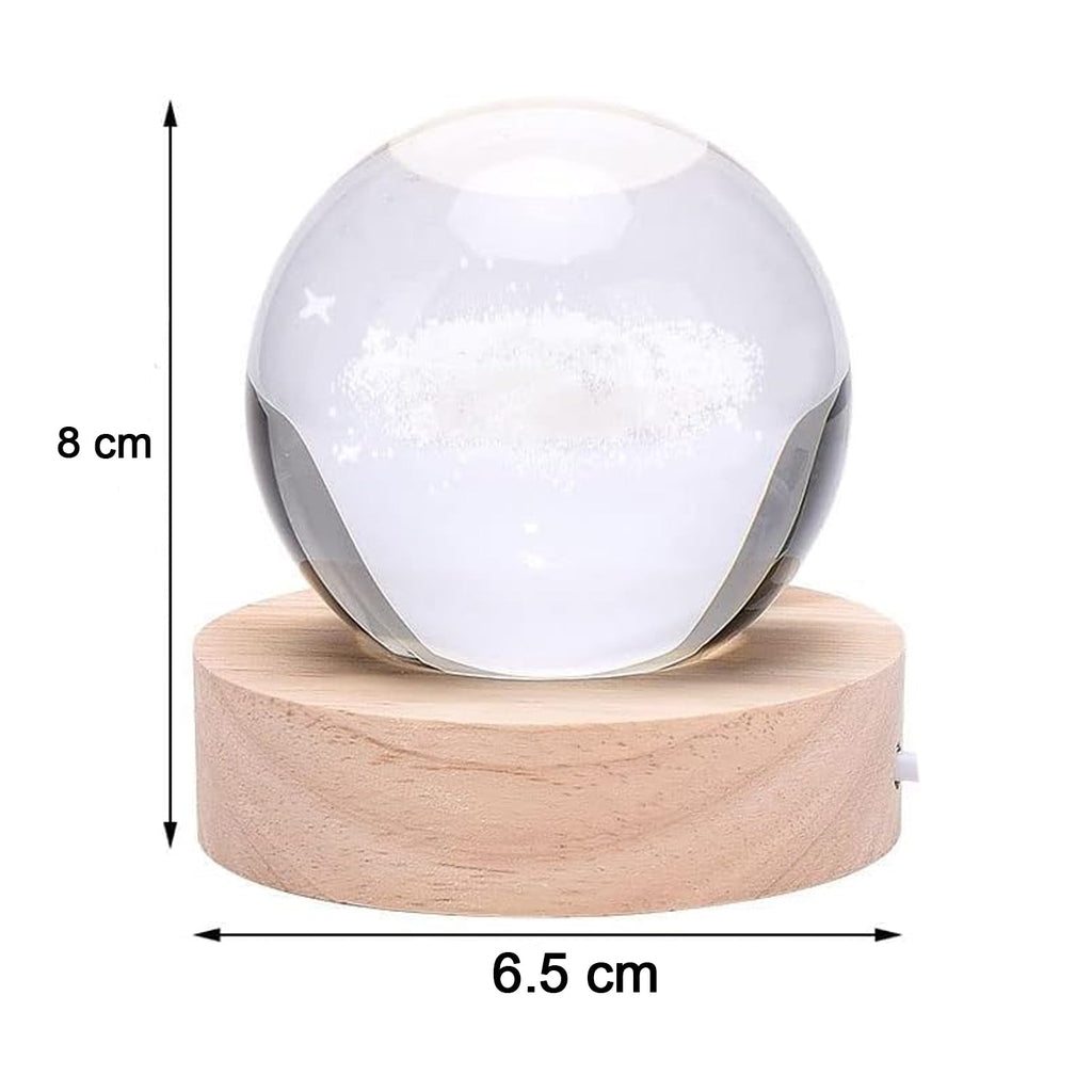 Hand holding the crystal ball lamp to show its compact size and portability.
