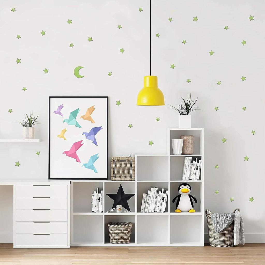 Fluorescent star and moon stickers glowing brightly at night, bringing the wonders of the cosmos indoors.