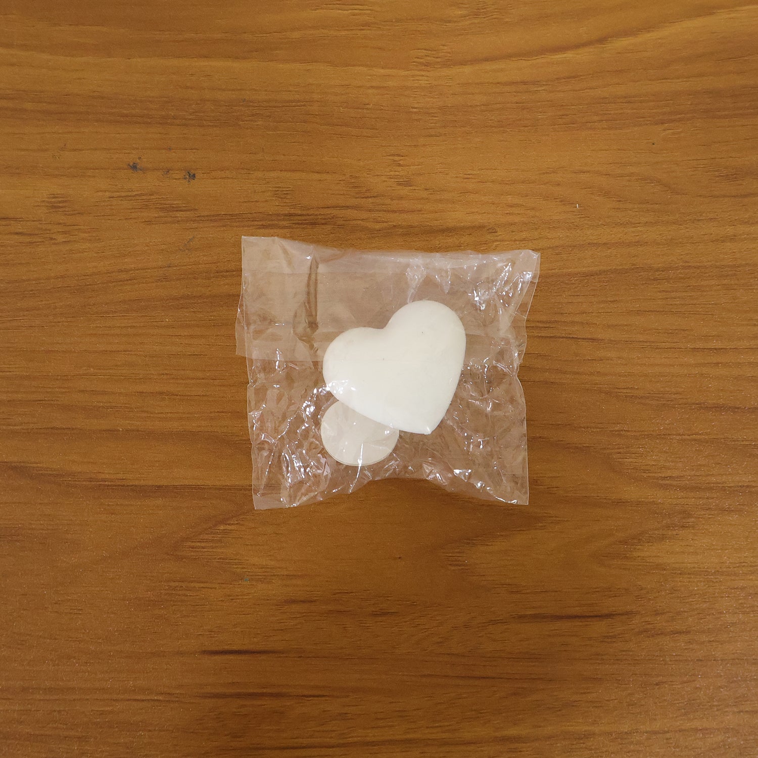 Bathroom flush control button with heart shape design
