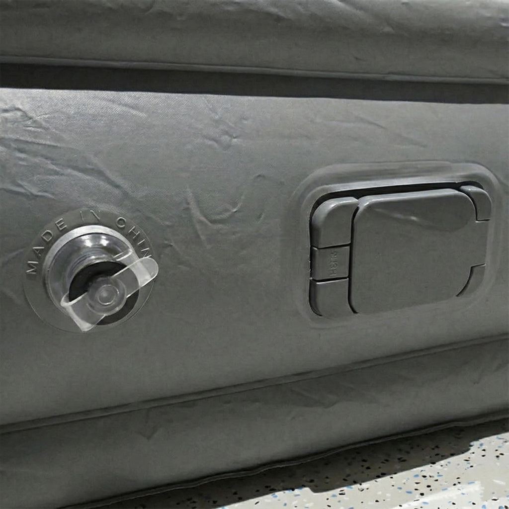 Portable inflatable bed partially folded illustrating compact and lightweight design
