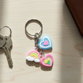 Heart and rainbow charm keychain with multiple colorful hanging charms