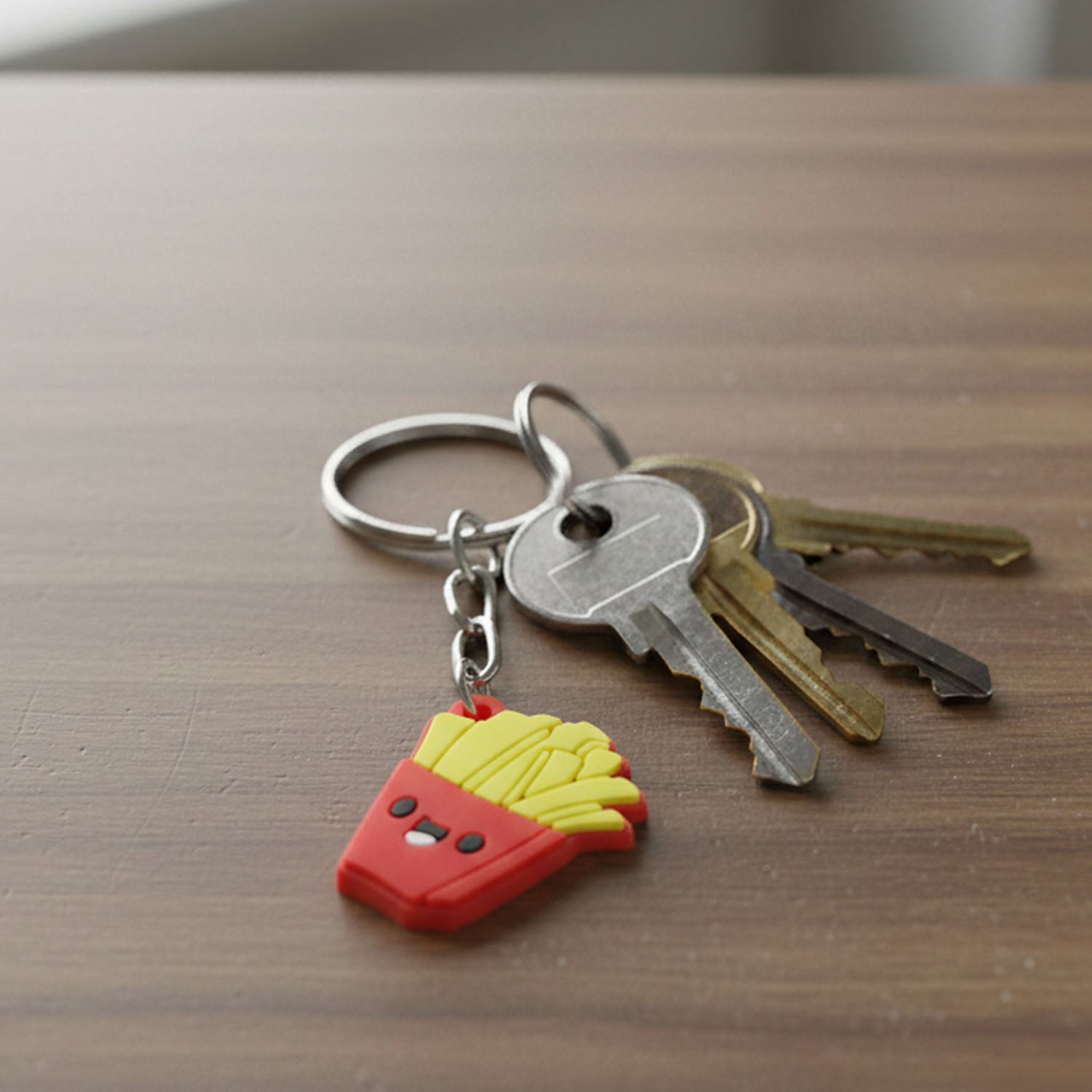 Decorative French fries cartoon keyring with smiley face on a key holder