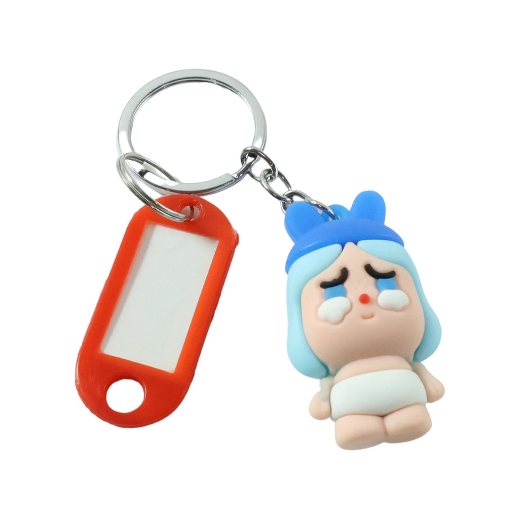 Keychain accessory featuring cartoon baby character and functional label tag.