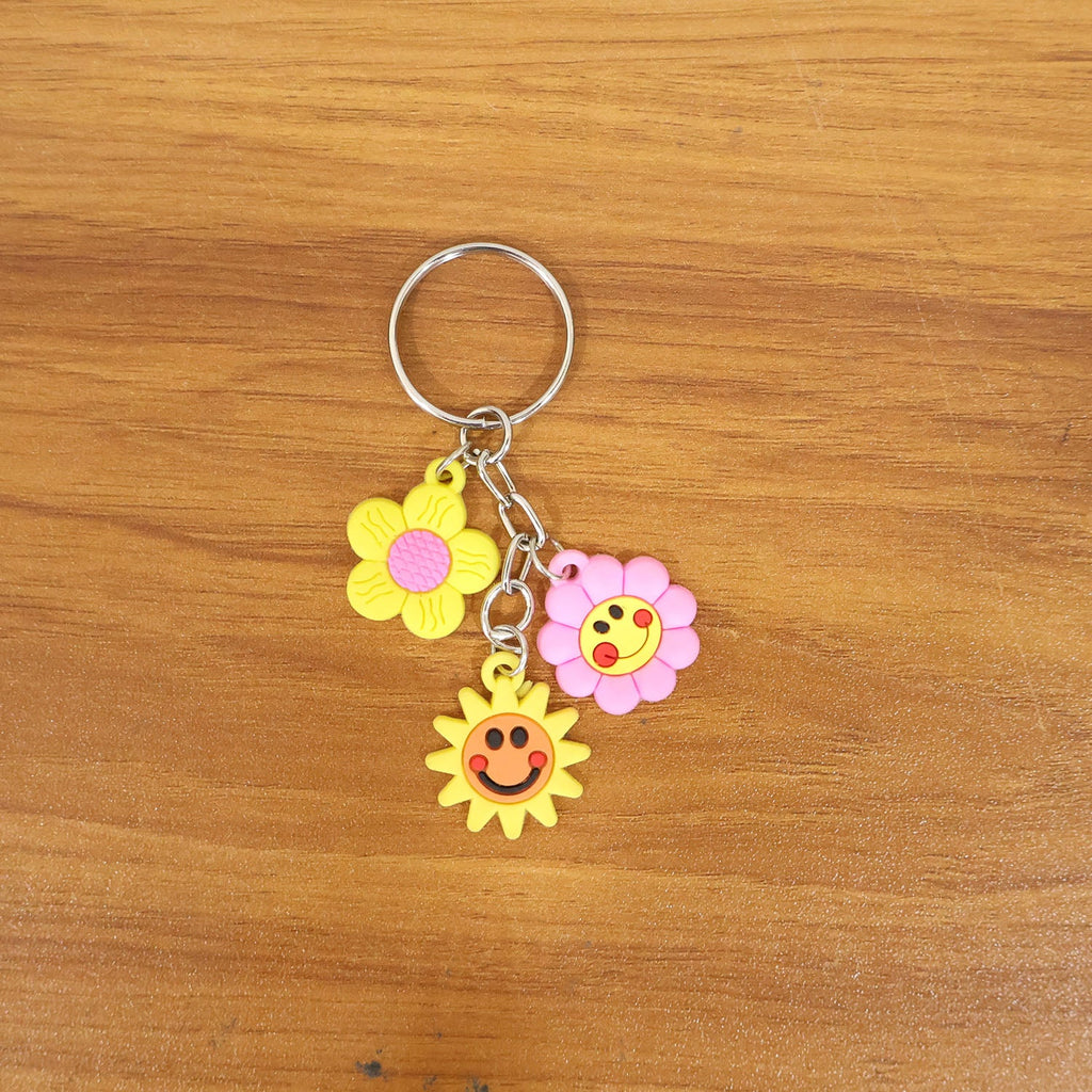 Flower cartoon keychain adding cheerful design to a backpack