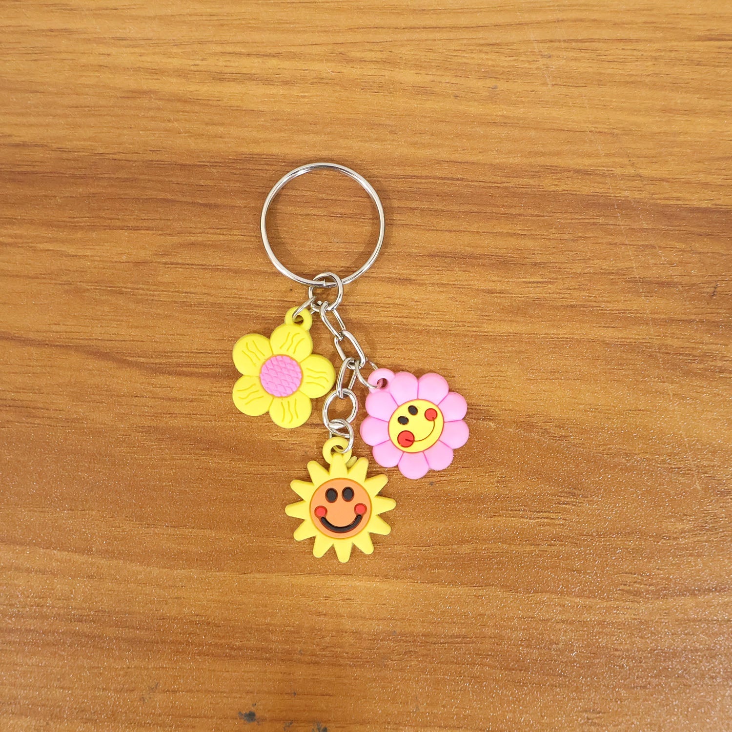 Flower cartoon keychain adding cheerful design to a backpack