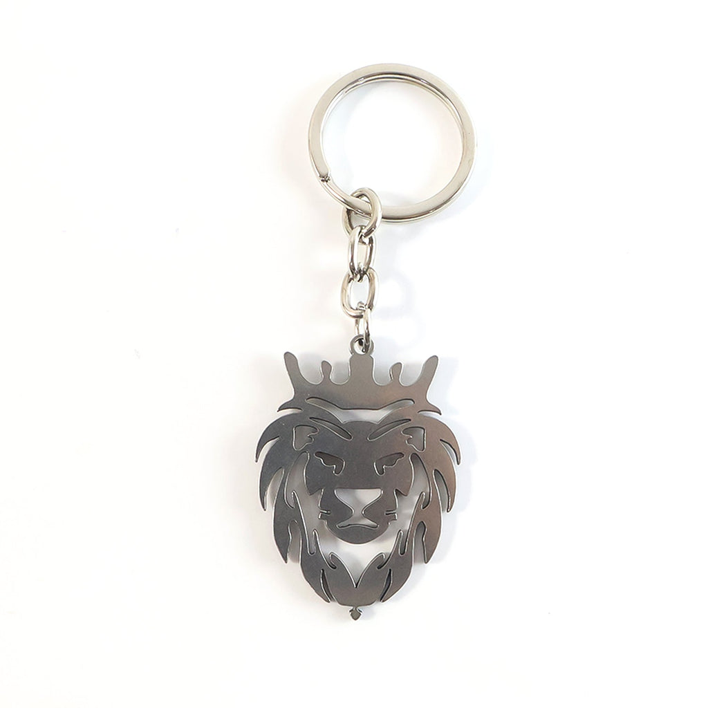 Angled view of metal lion head keychain highlighting textured craftsmanship