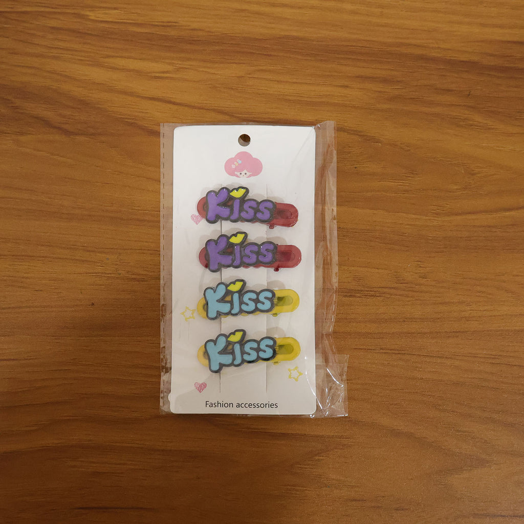 Woman wearing a Kiss text hair clip in long flowing hair