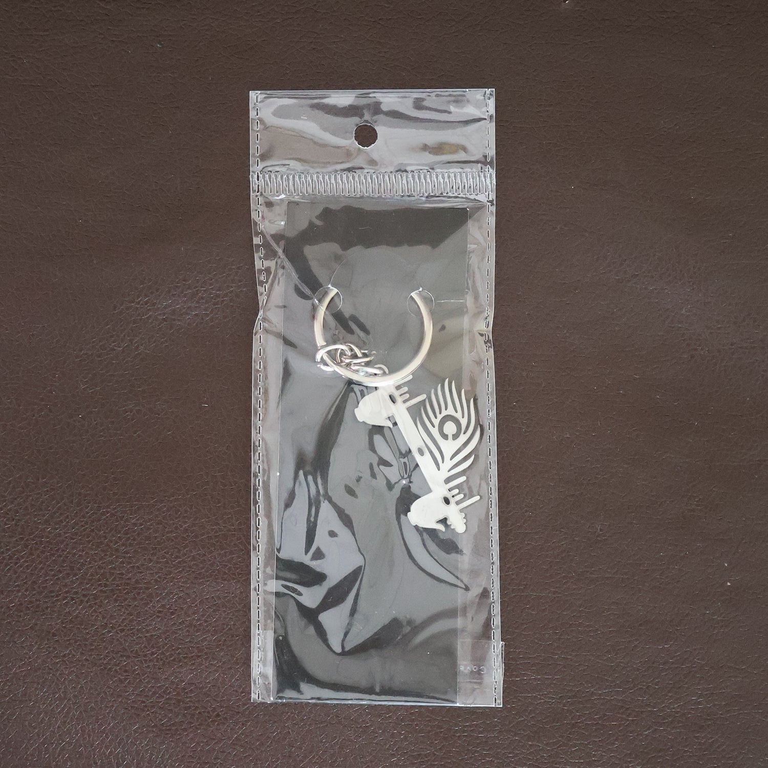 Krishna Flute Keychain displayed in a lifestyle setting, perfect for daily use.
