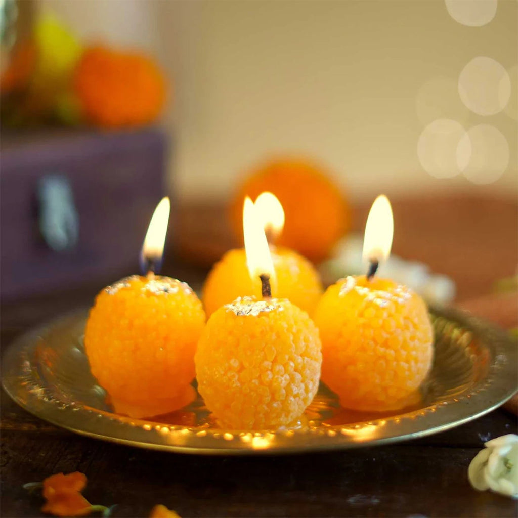 Close-up of laddu shaped wax candle showing detailed craftsmanship